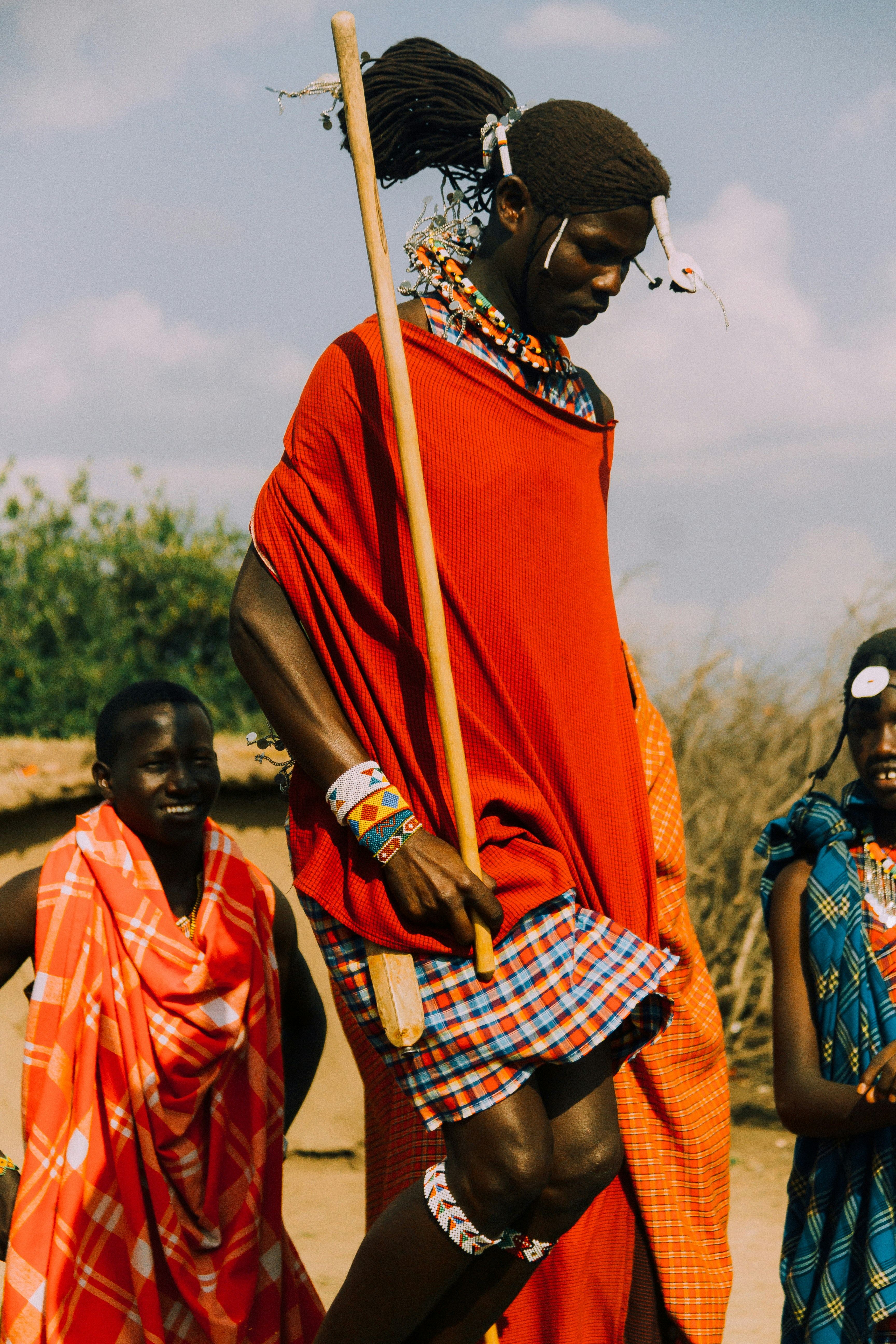 Maasai individual in traditional attire representing cultural heritage preservation